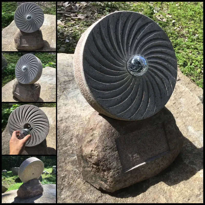 Mūsdienu eksperimentāls mazizmēra kapa piemineklis. Stikls, aplis un apgaismojums