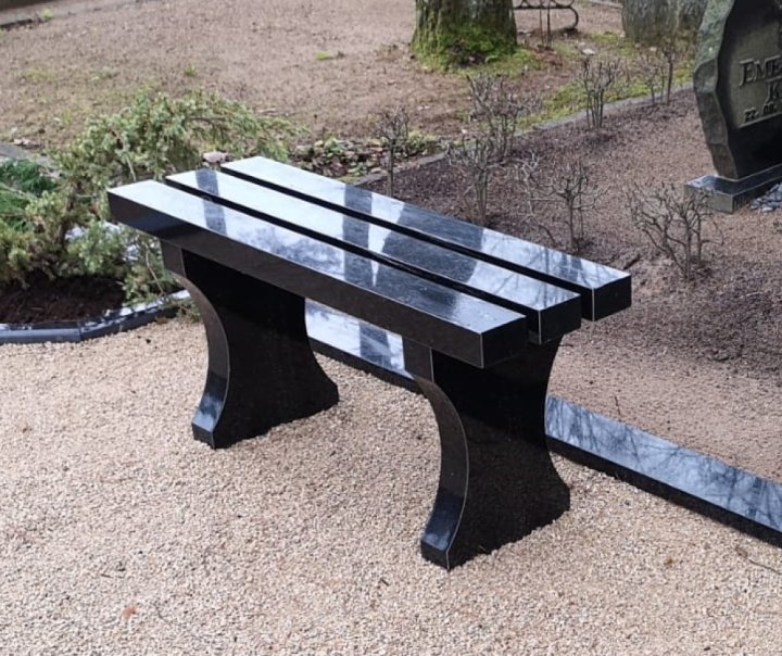 Granite bench with intricately carved legs