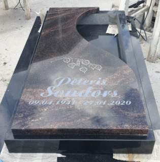 Granite gravestone with a heart-shaped cutout 