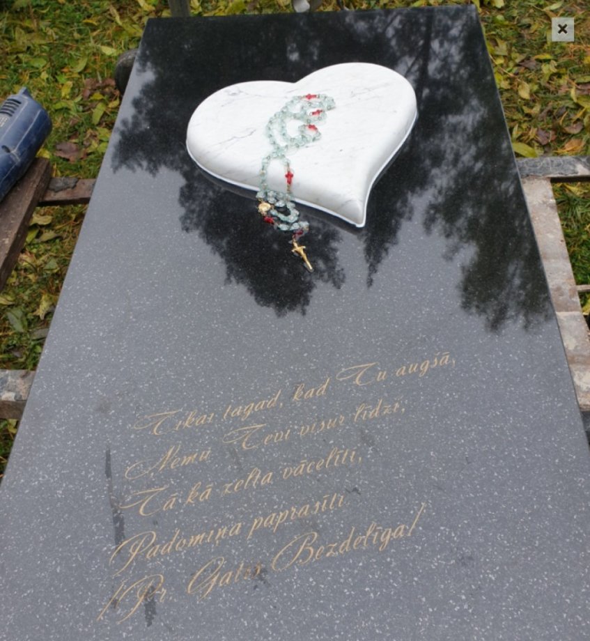 Granite gravestone with a heart, made of two types of granite
