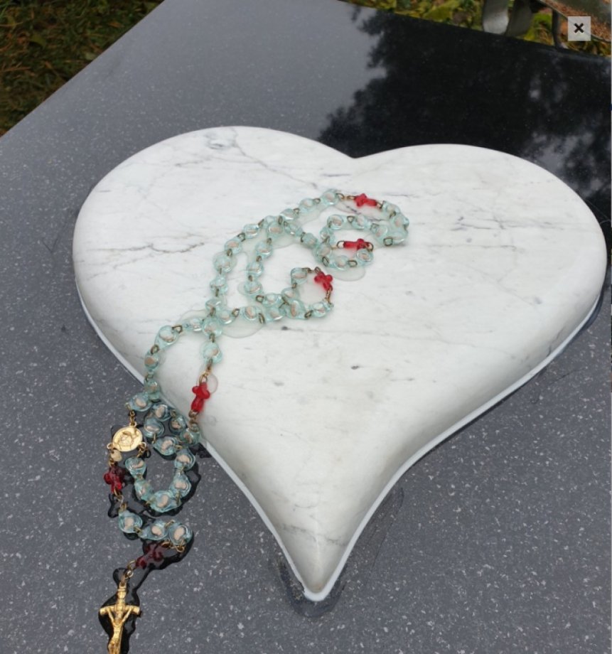 Granite gravestone with a heart of two types of granite