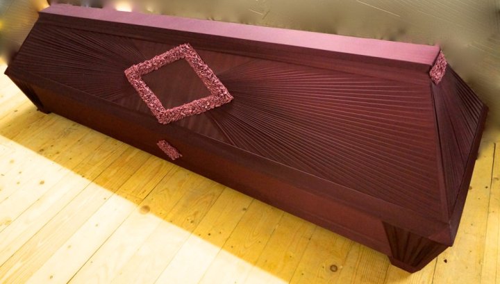 Draped wooden caskets