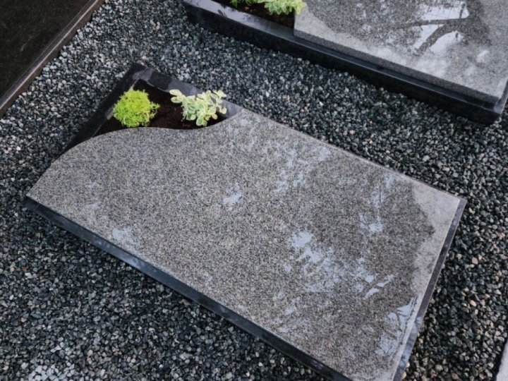 Granite gravestone with an open corner