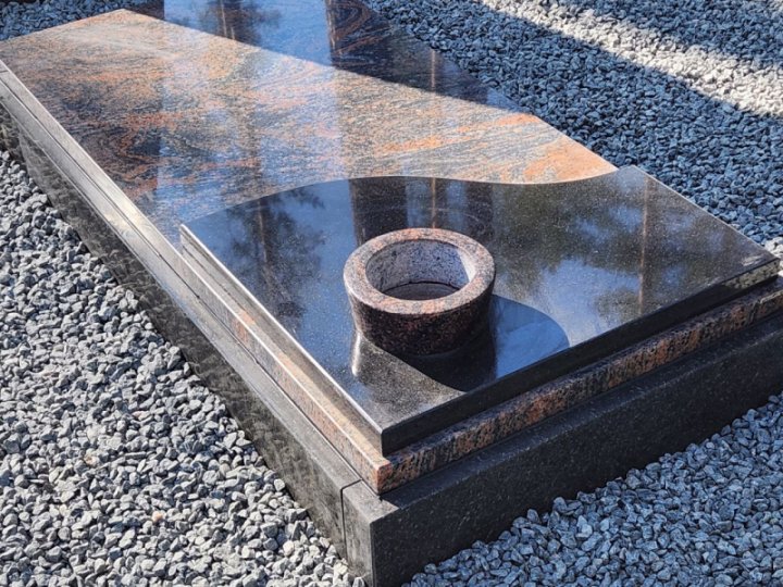 Granite gravestone with built-in vase
