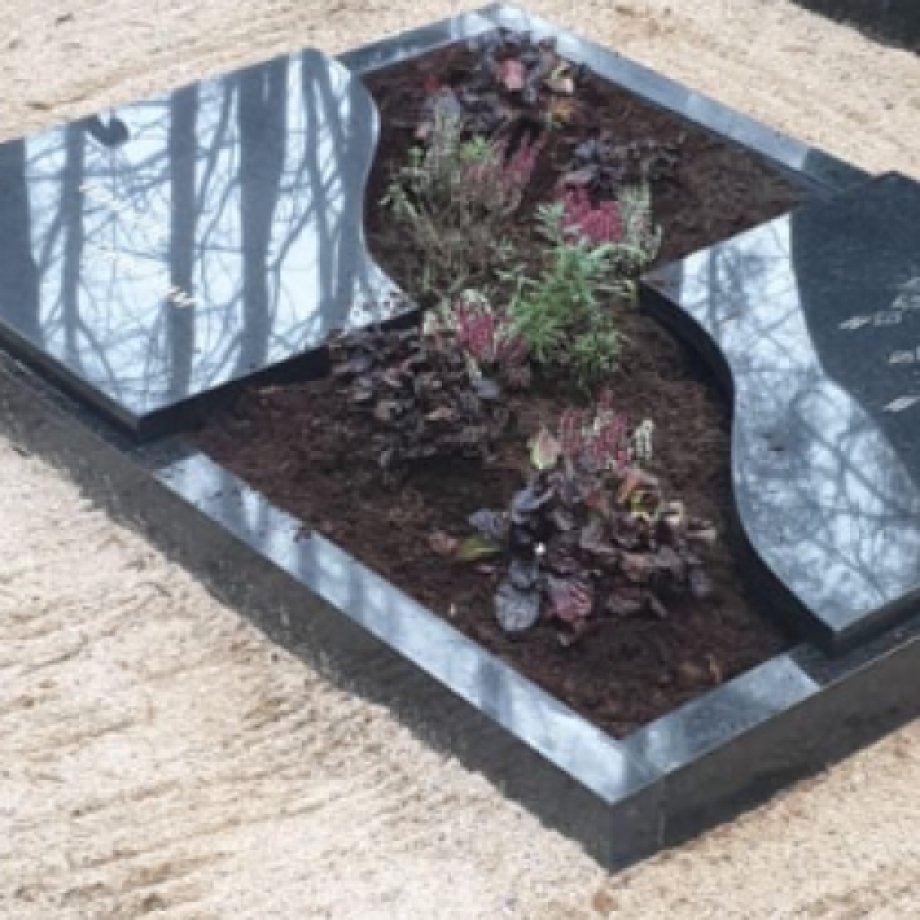 Granite gravestone with partially closed surface