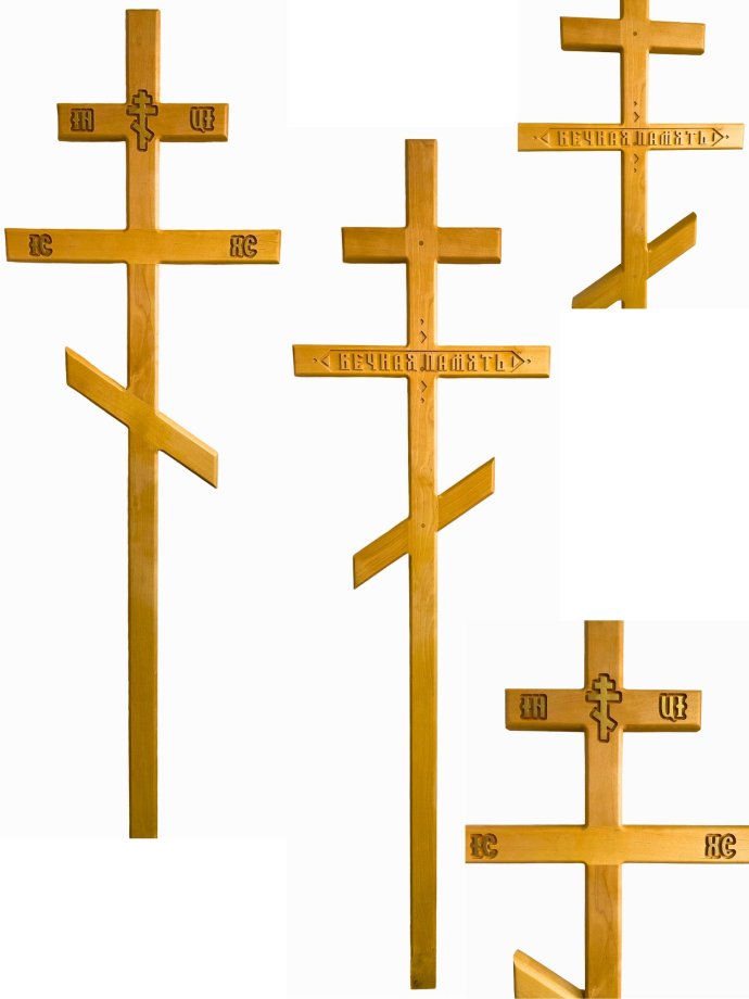 Light-coloured Orthodox wooden crosses with engraving