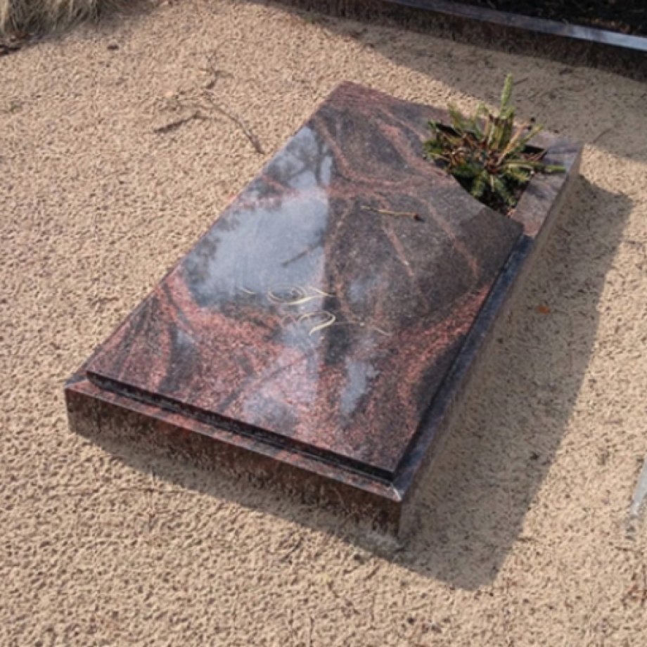 Granite gravestone with an open corner