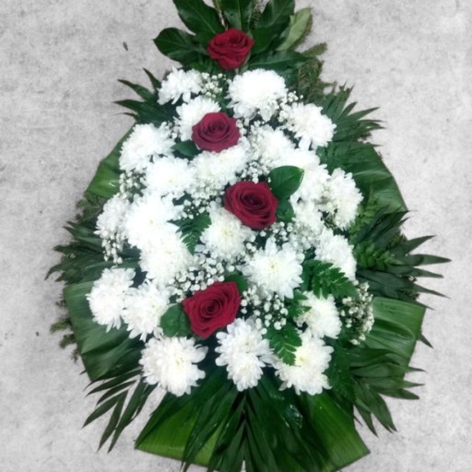 Funeral spray made of red roses and white chrysanthemums