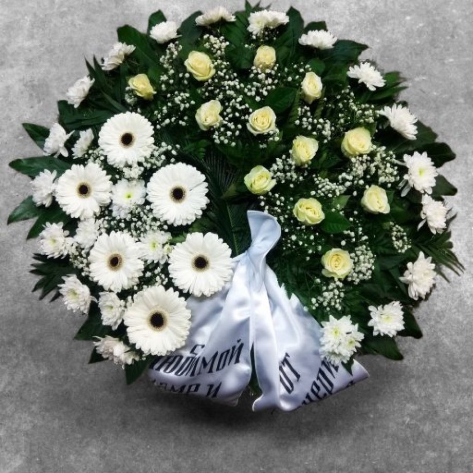 Funeral wreath of roses, gerberas and chrysanthemums