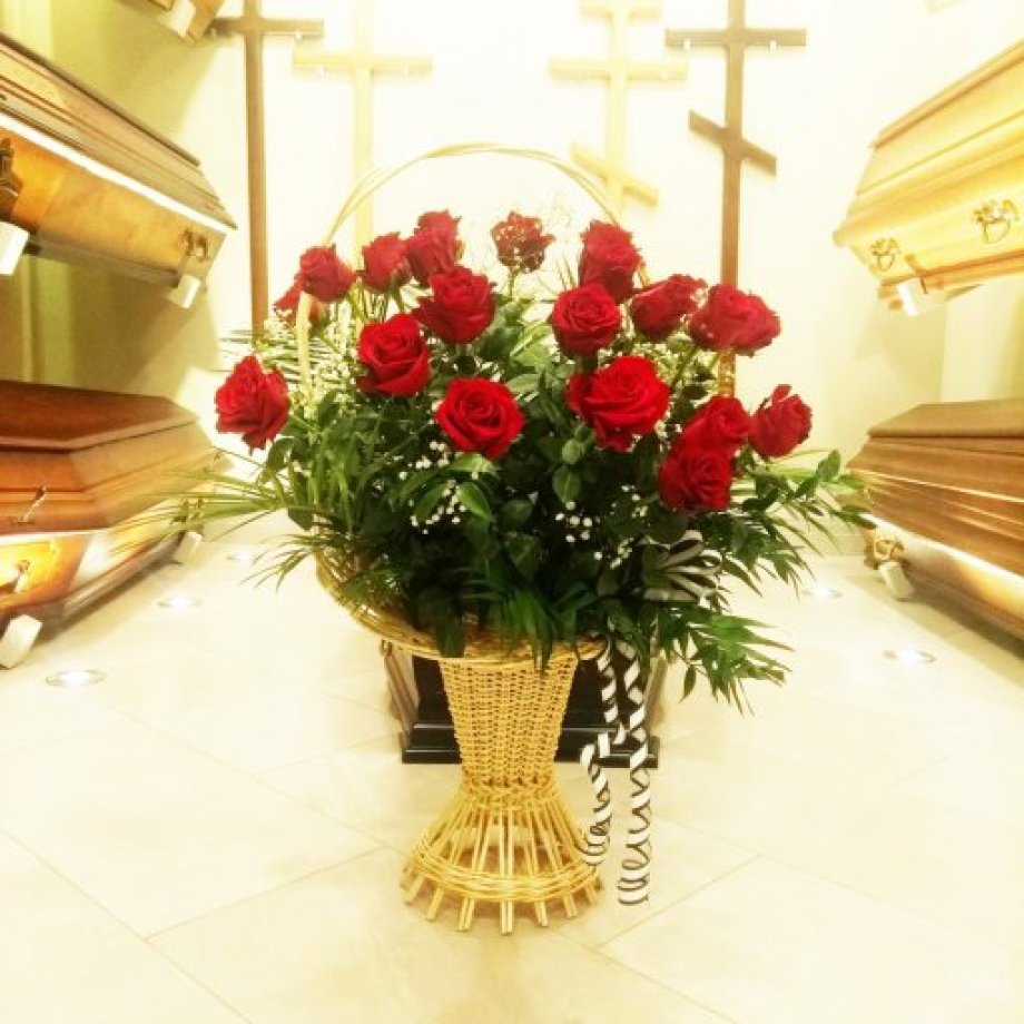 Flower basket with red roses for the farewell ceremony