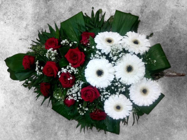 Funeral spray of white and red flowers