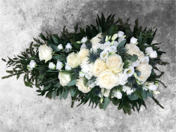 Funeral spray of white flowers
