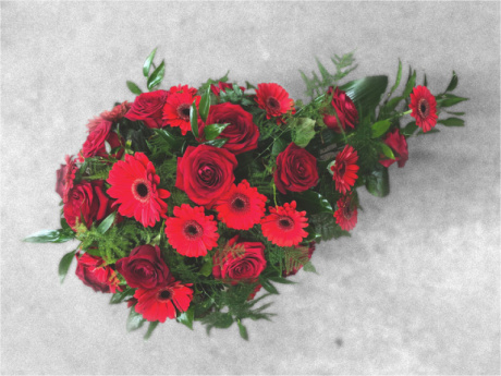 Funeral spray with red flowers for a beautiful farewell ceremony