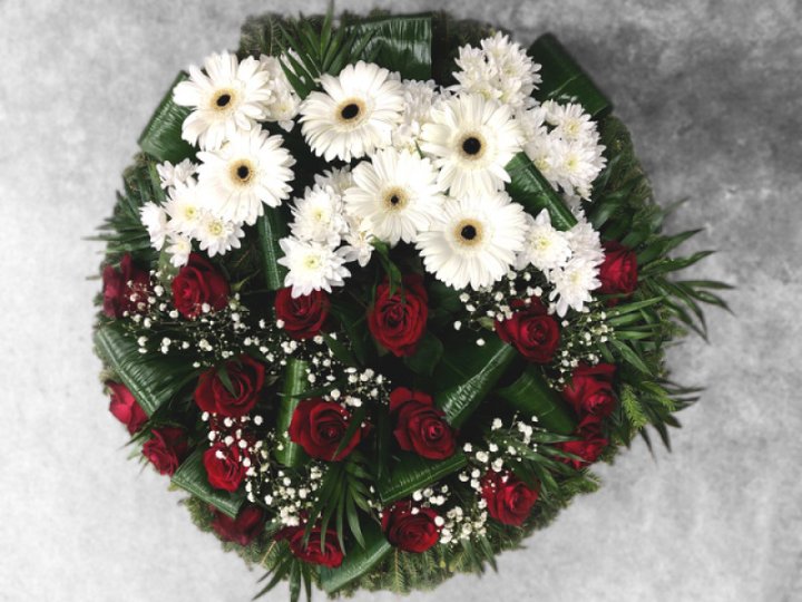 Mourning wreath with white and red flowers