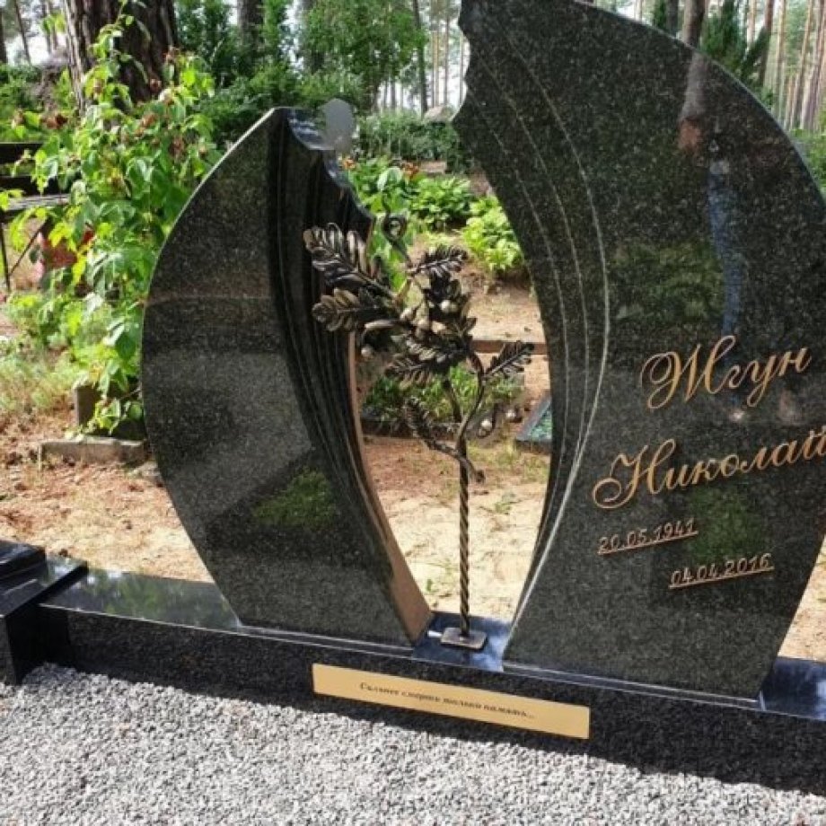 Exclusive granite gravestone of two parts with wrought iron decoration