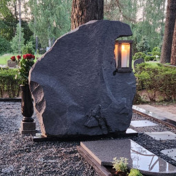Preview image for  Rough-cut granite headstone with a candle holder