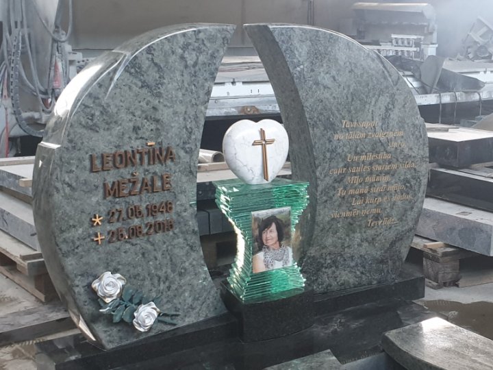 A granite gravestone made of two parts, resembling wings