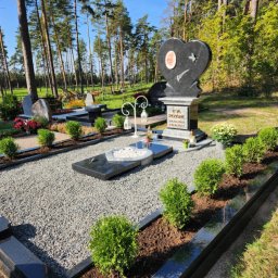 Preview image for  A funerary monument with a heart on an elegant pedestal, made of black and white granite