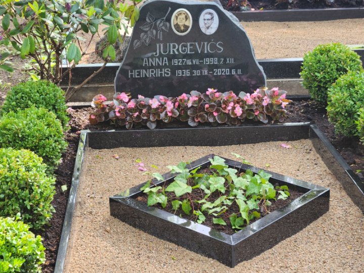 Rough-hewn granite grave monument