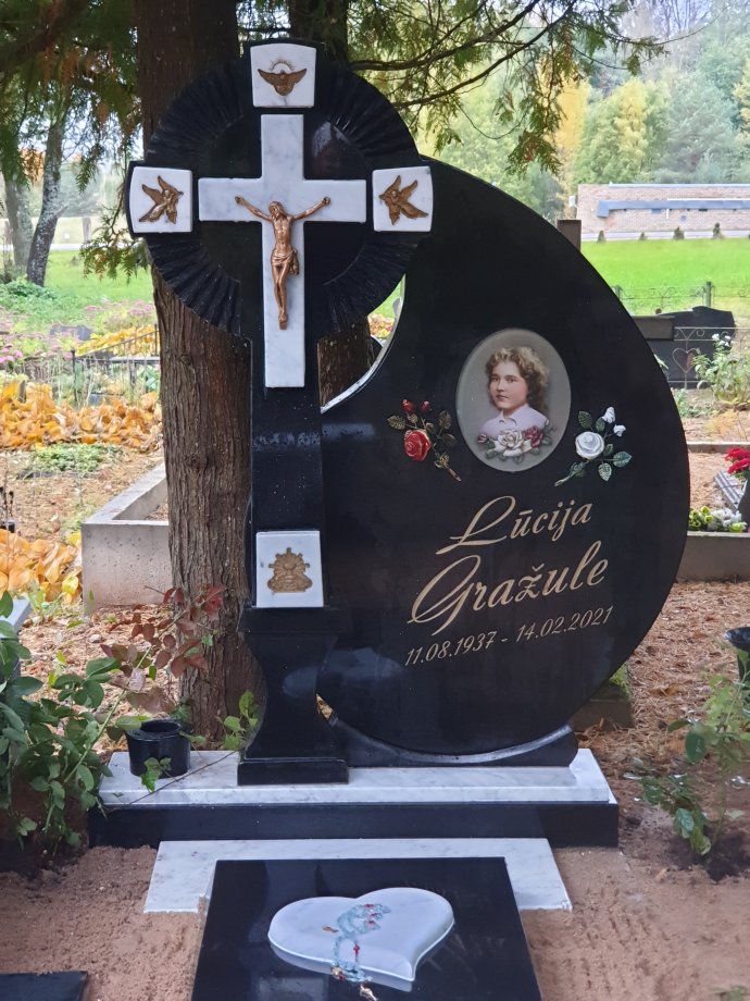 Granite funerary monument with a Catholic cross